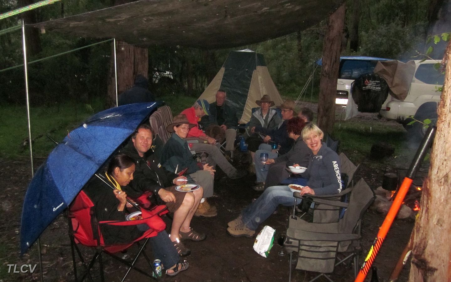 19-A wet night, but the convoy enjoys an evening under Smurf's tarp!.JPG